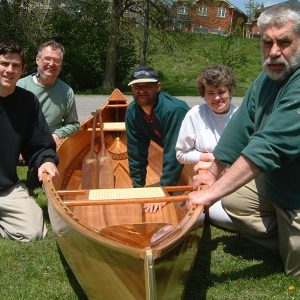 men and a canoe